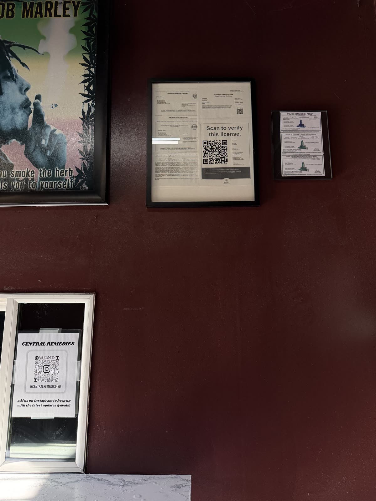 Framed California cannabis retail license on the wall inside Central Remedies.